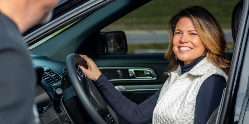 Smiling Woman in Car